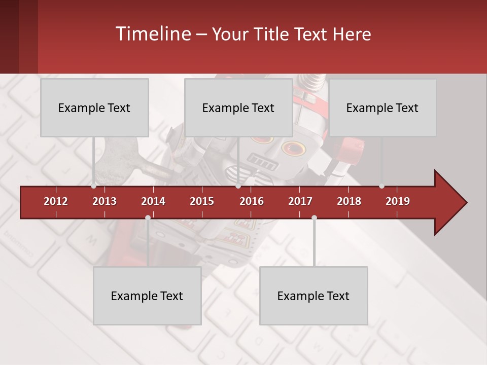 A Robot Keychain Sitting On Top Of A Keyboard PowerPoint Template