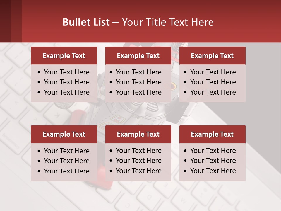 A Robot Keychain Sitting On Top Of A Keyboard PowerPoint Template
