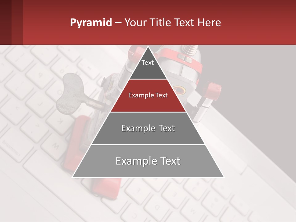A Robot Keychain Sitting On Top Of A Keyboard PowerPoint Template