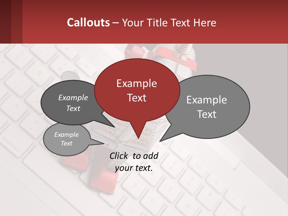 A Robot Keychain Sitting On Top Of A Keyboard PowerPoint Template