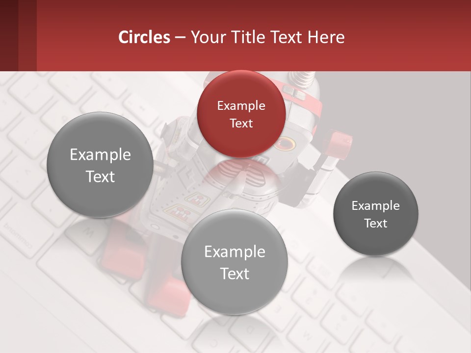 A Robot Keychain Sitting On Top Of A Keyboard PowerPoint Template