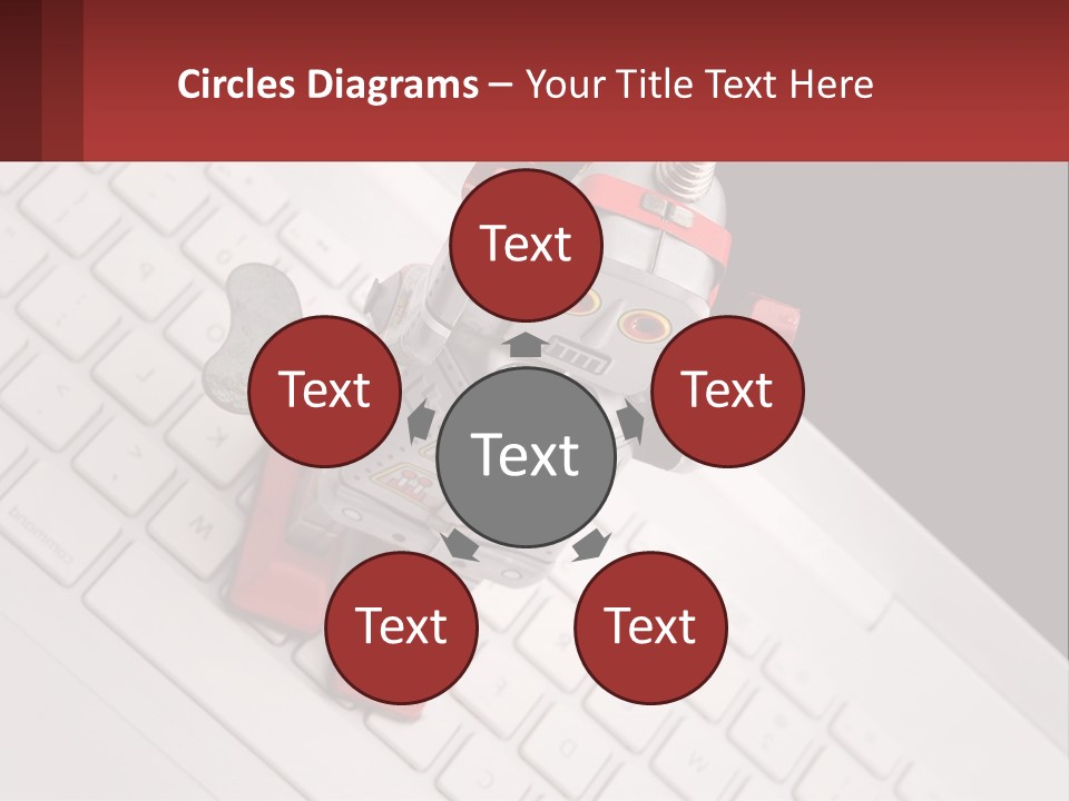 A Robot Keychain Sitting On Top Of A Keyboard PowerPoint Template