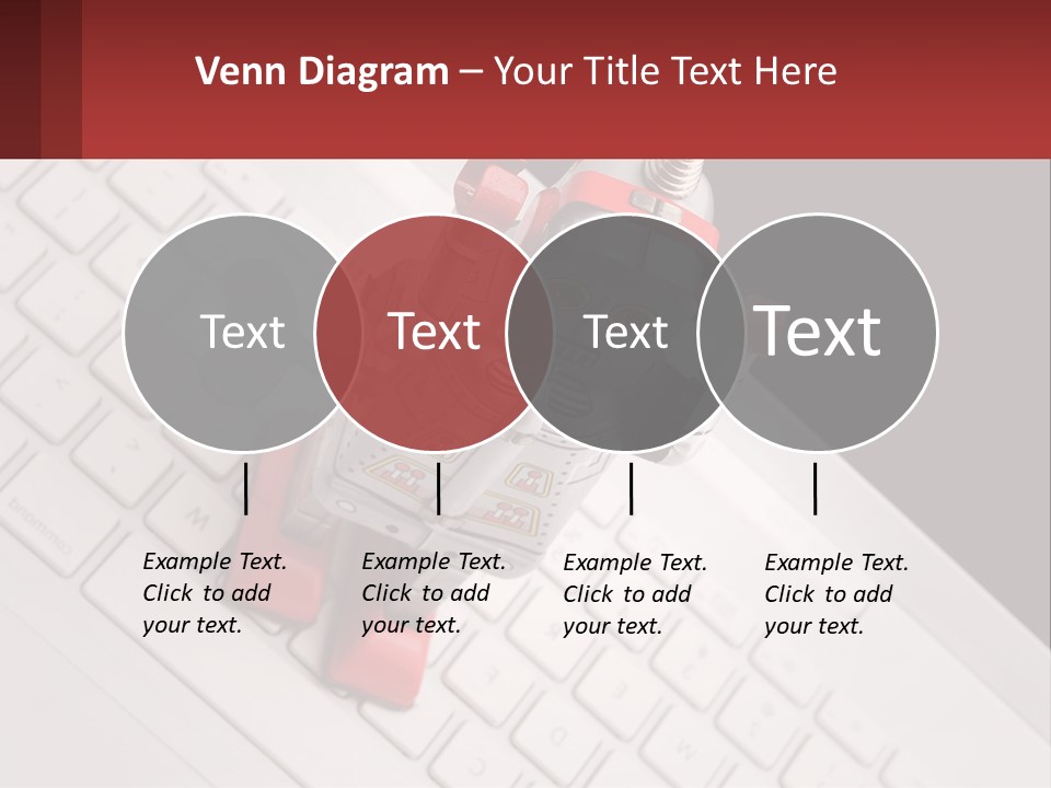 A Robot Keychain Sitting On Top Of A Keyboard PowerPoint Template