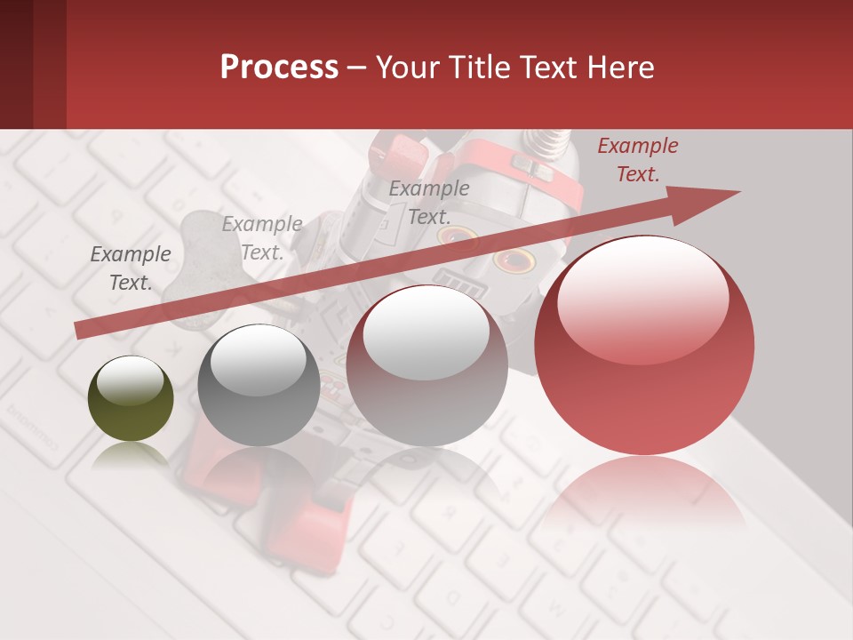 A Robot Keychain Sitting On Top Of A Keyboard PowerPoint Template