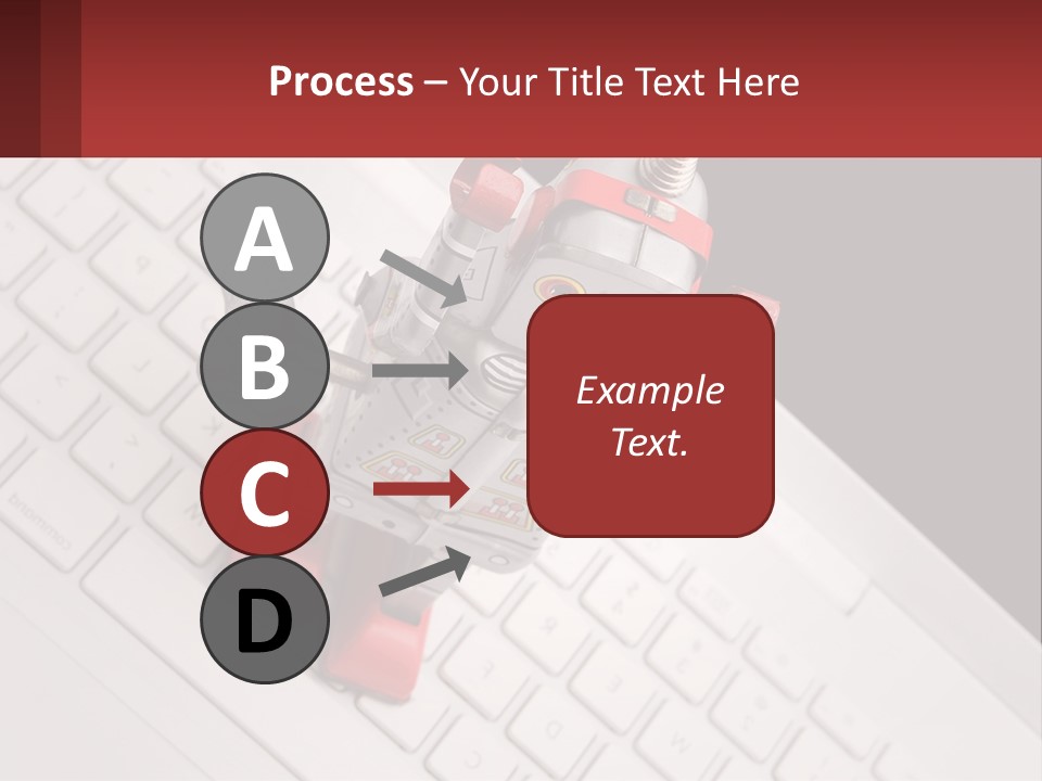 A Robot Keychain Sitting On Top Of A Keyboard PowerPoint Template