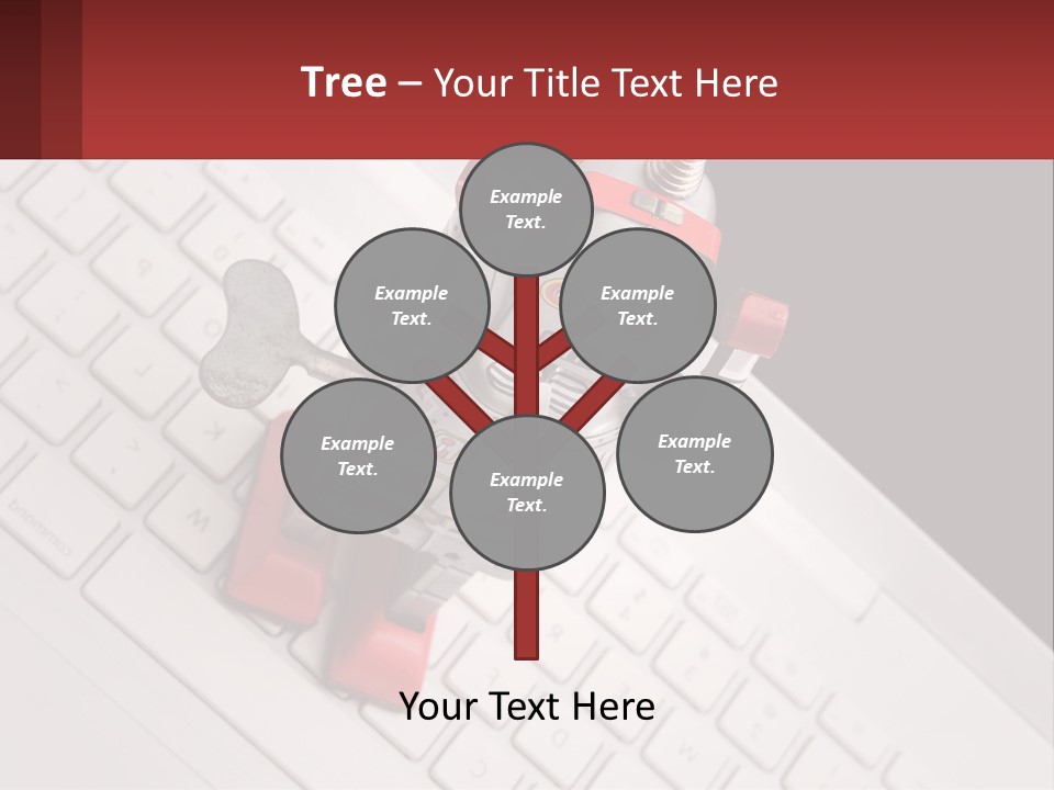 A Robot Keychain Sitting On Top Of A Keyboard PowerPoint Template