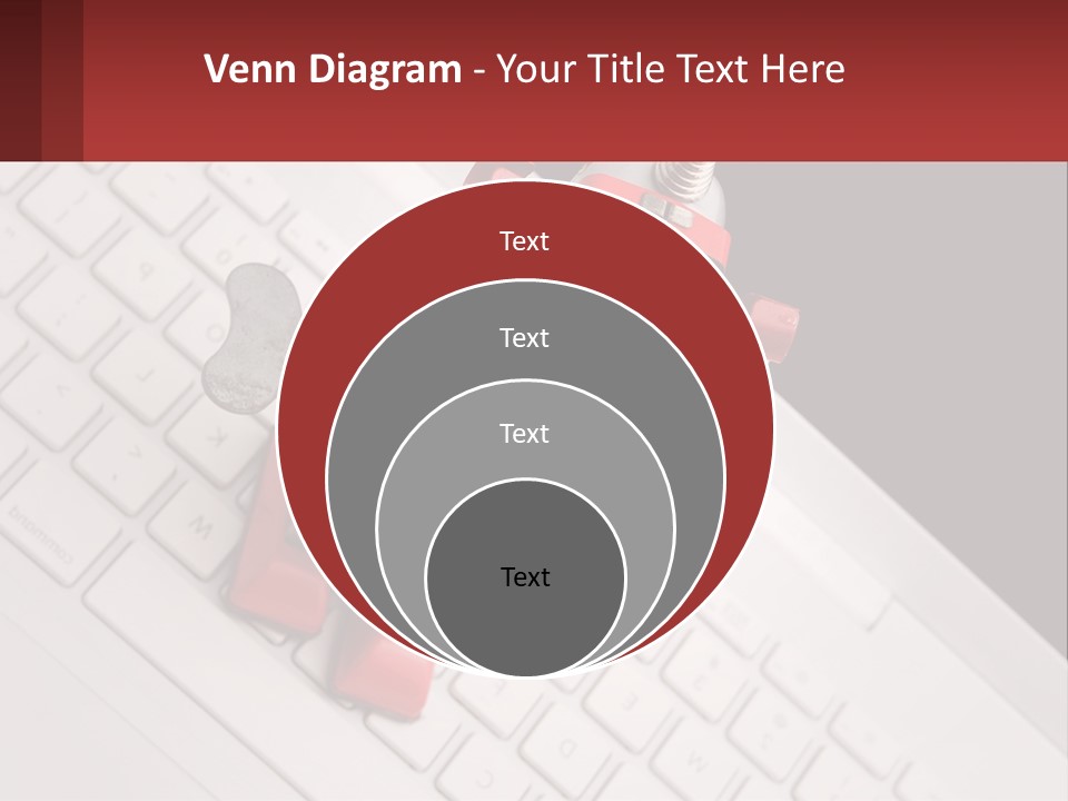 A Robot Keychain Sitting On Top Of A Keyboard PowerPoint Template