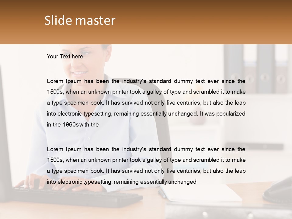 A Woman Sitting At A Desk In Front Of A Computer PowerPoint Template