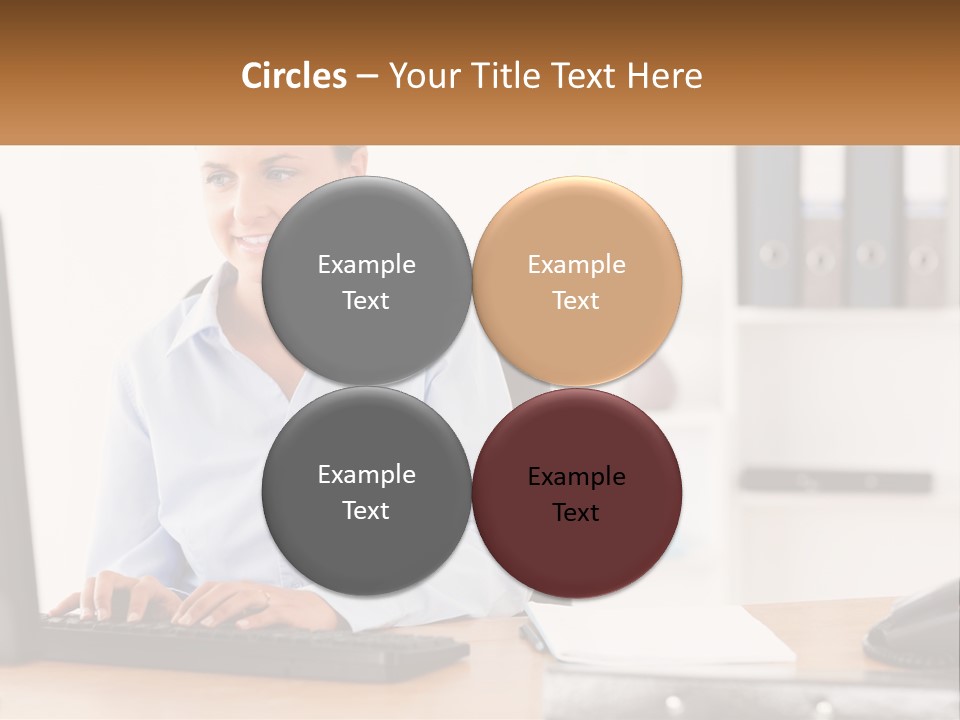 A Woman Sitting At A Desk In Front Of A Computer PowerPoint Template