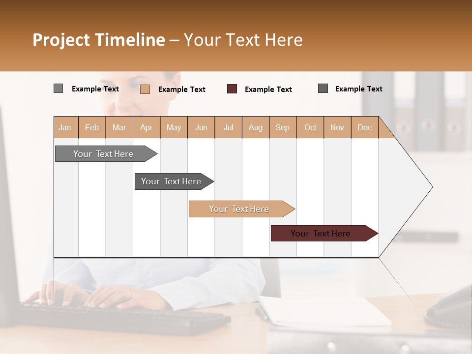 A Woman Sitting At A Desk In Front Of A Computer PowerPoint Template