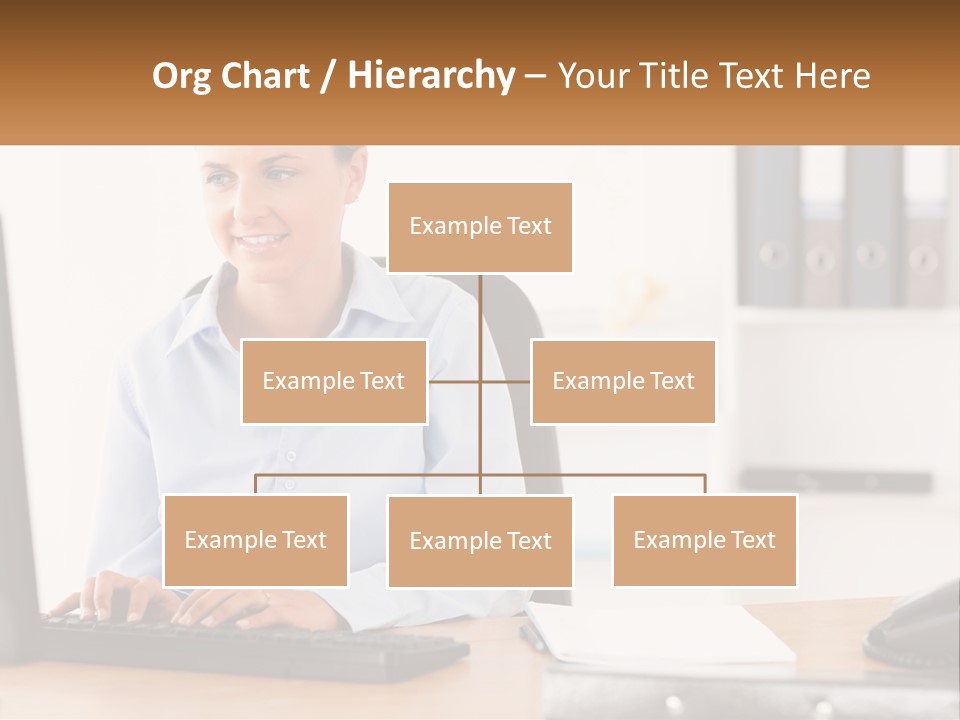 A Woman Sitting At A Desk In Front Of A Computer PowerPoint Template