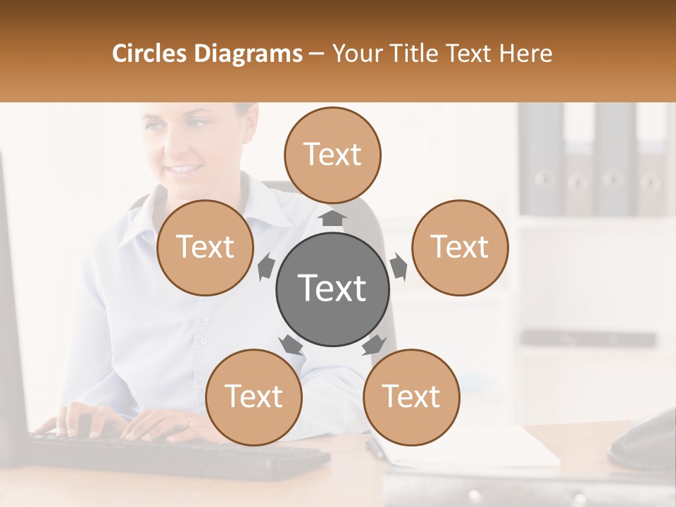 A Woman Sitting At A Desk In Front Of A Computer PowerPoint Template