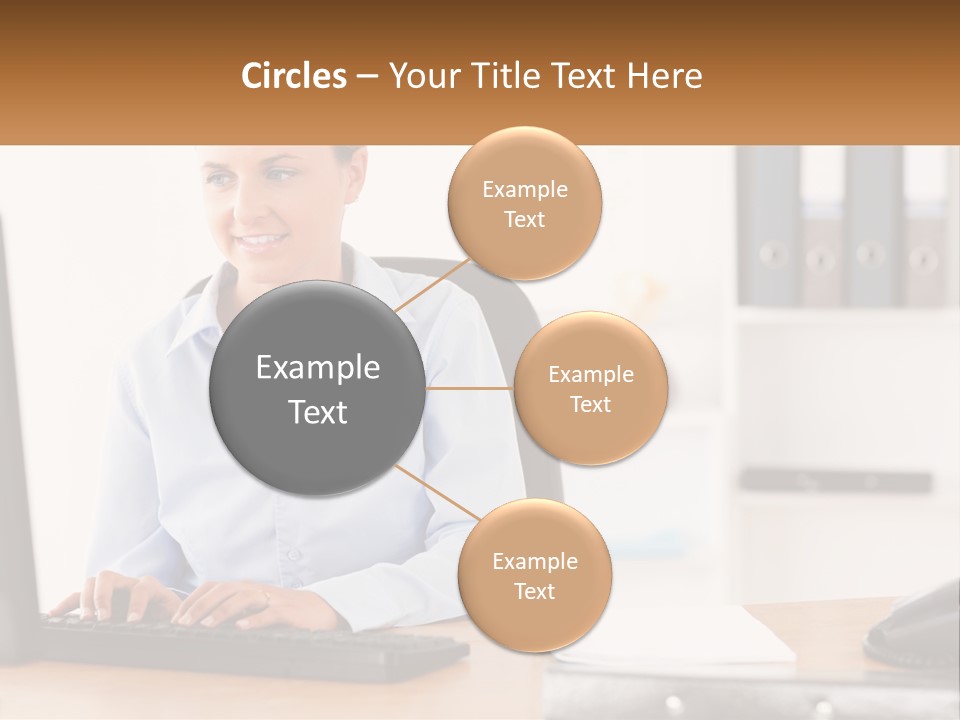 A Woman Sitting At A Desk In Front Of A Computer PowerPoint Template