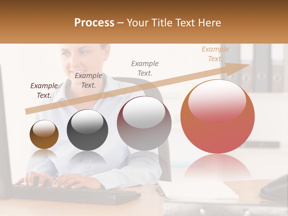 A Woman Sitting At A Desk In Front Of A Computer PowerPoint Template