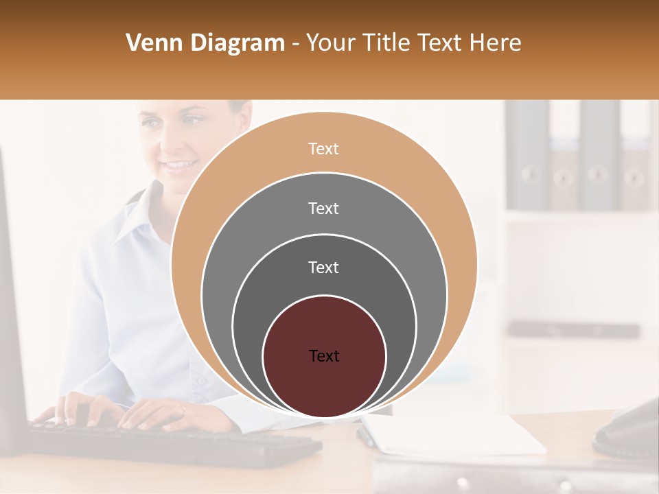 A Woman Sitting At A Desk In Front Of A Computer PowerPoint Template