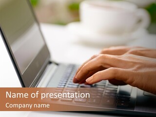 A Person Typing On A Laptop On A Table PowerPoint Template