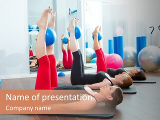 A Group Of Women Doing Yoga Exercises In A Gym PowerPoint Template