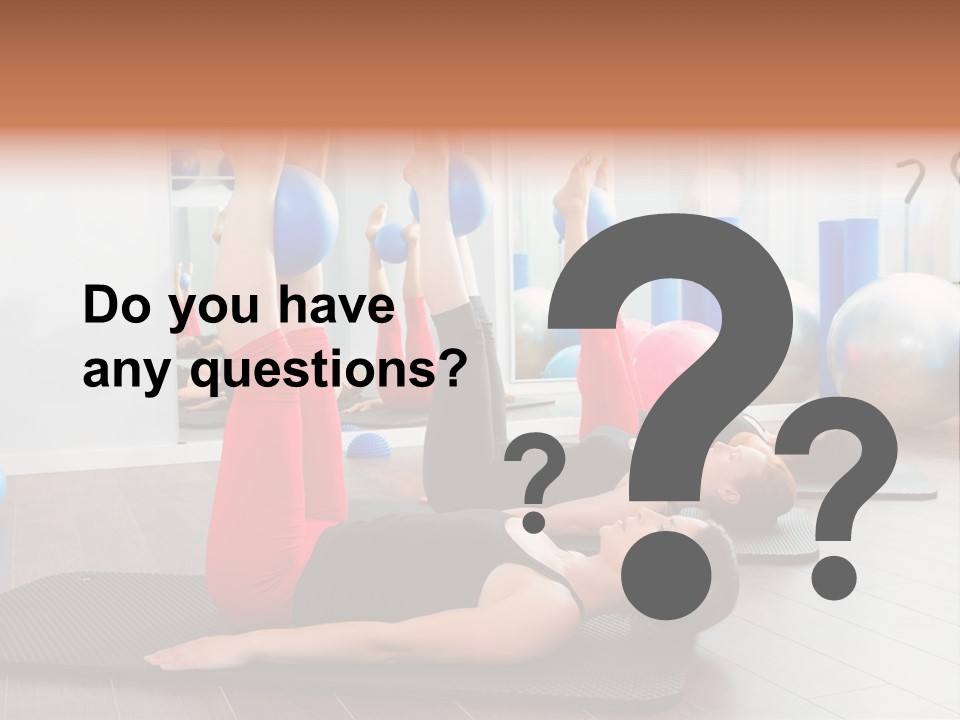 A Group Of Women Doing Yoga Exercises In A Gym PowerPoint Template