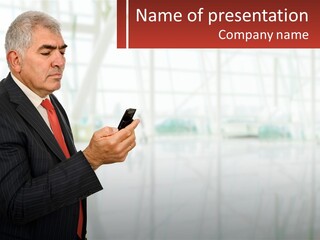 A Man In A Suit Holding A Cell Phone PowerPoint Template