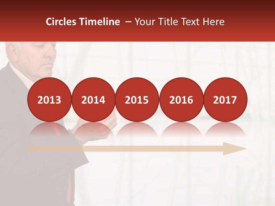 A Man In A Suit Holding A Cell Phone PowerPoint Template