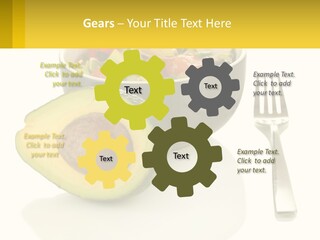 A Bowl Of Salad With An Avocado Next To A Fork PowerPoint Template