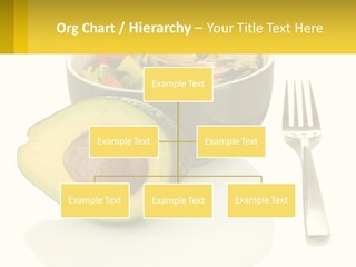 A Bowl Of Salad With An Avocado Next To A Fork PowerPoint Template