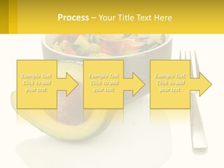 A Bowl Of Salad With An Avocado Next To A Fork PowerPoint Template