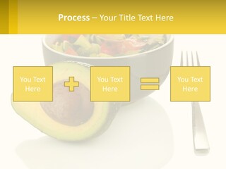 A Bowl Of Salad With An Avocado Next To A Fork PowerPoint Template