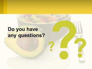 A Bowl Of Salad With An Avocado Next To A Fork PowerPoint Template