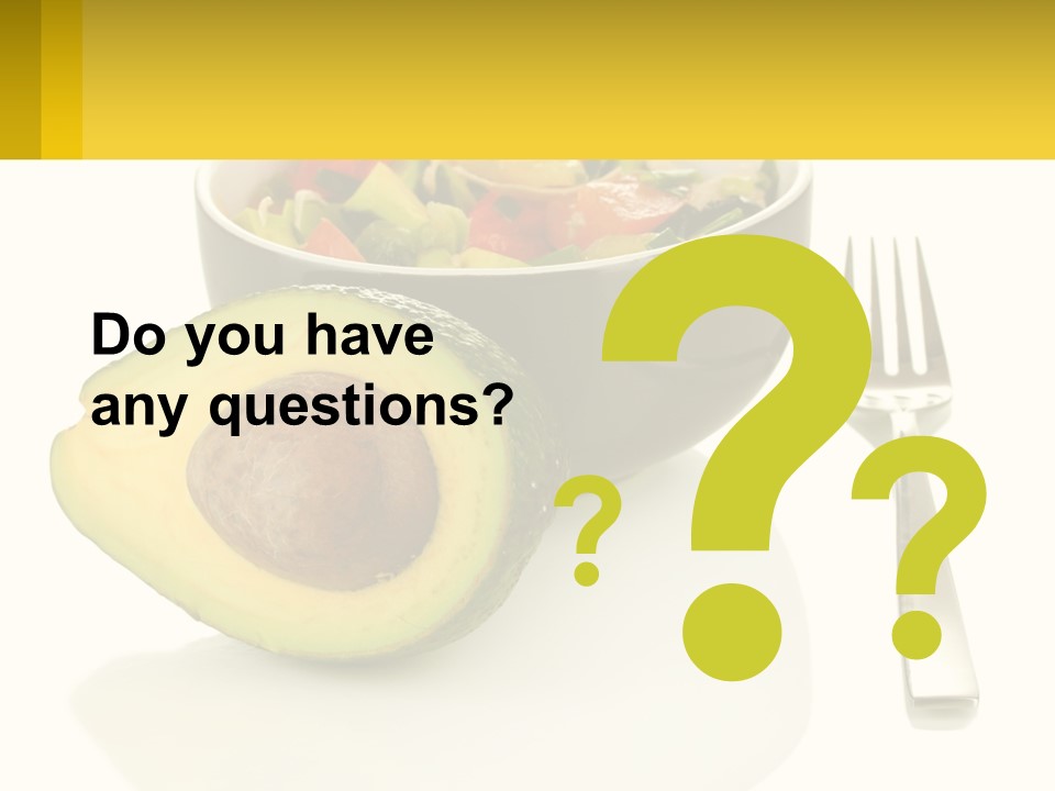 A Bowl Of Salad With An Avocado Next To A Fork PowerPoint Template