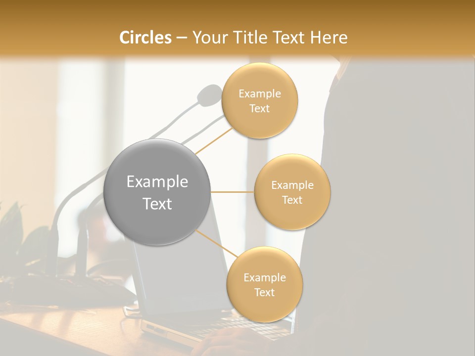 A Man Standing At A Podium With A Laptop In Front Of Him PowerPoint Template
