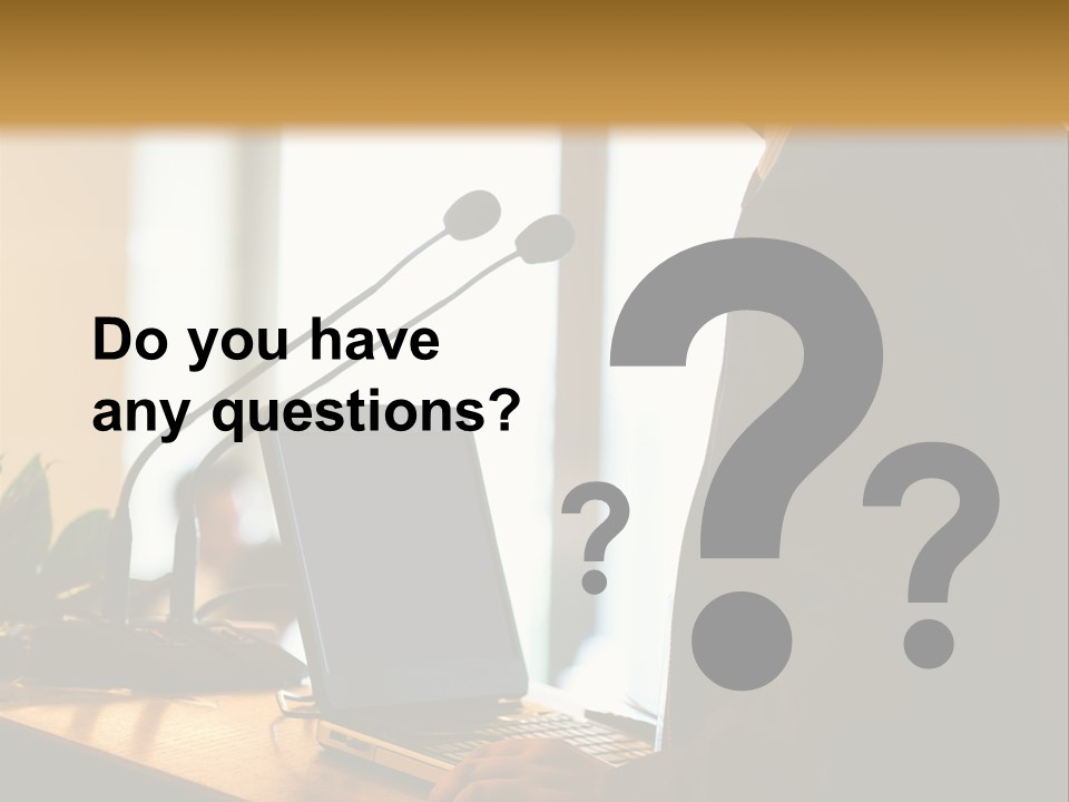 A Man Standing At A Podium With A Laptop In Front Of Him PowerPoint Template