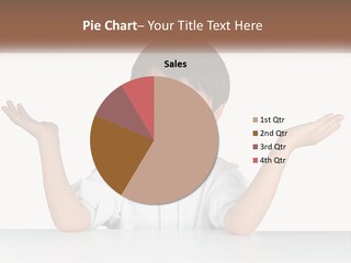 A Young Boy Sitting At A Table With His Hands Out PowerPoint Template