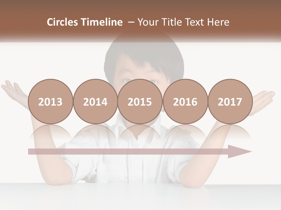 A Young Boy Sitting At A Table With His Hands Out PowerPoint Template