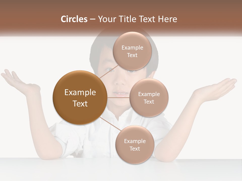 A Young Boy Sitting At A Table With His Hands Out PowerPoint Template
