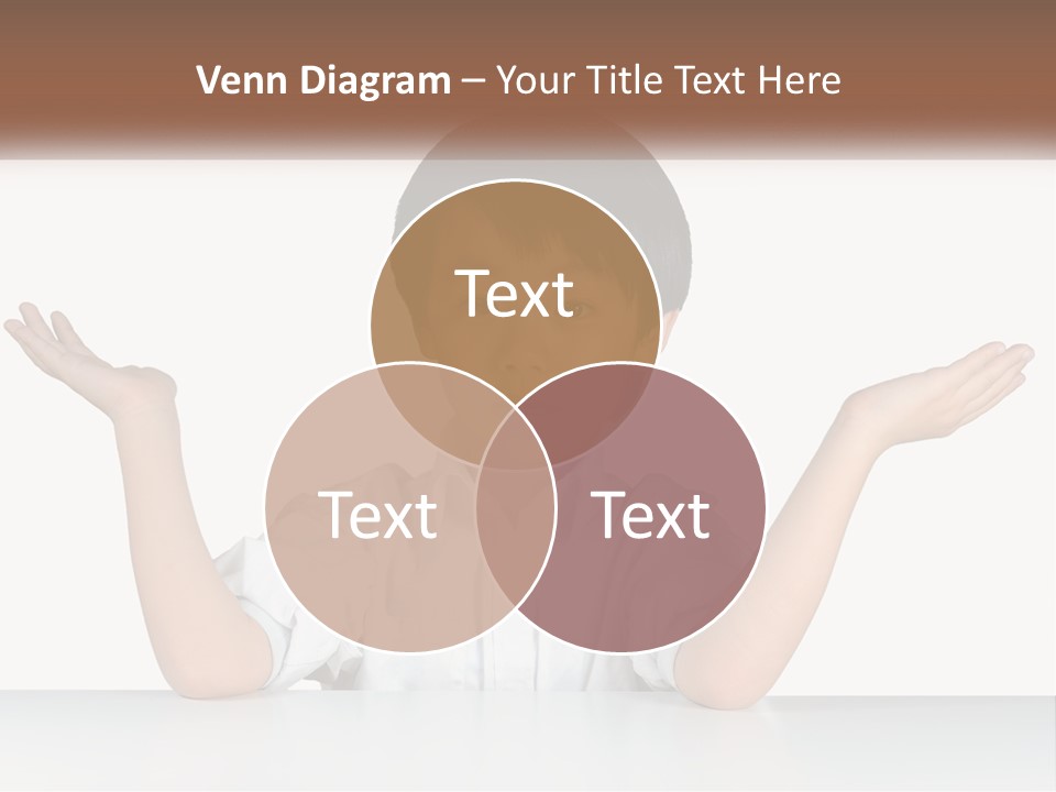 A Young Boy Sitting At A Table With His Hands Out PowerPoint Template