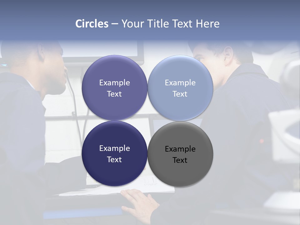 A Couple Of Men Sitting In Front Of A Laptop Computer PowerPoint Template