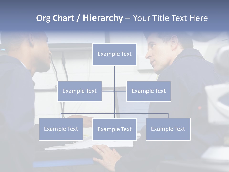 A Couple Of Men Sitting In Front Of A Laptop Computer PowerPoint Template