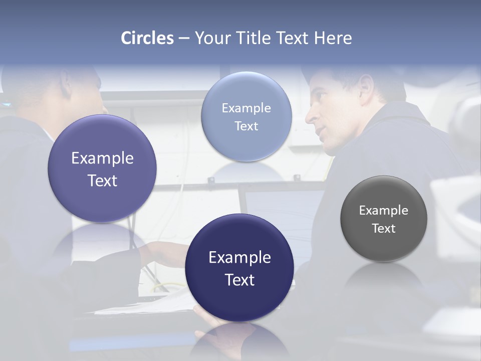 A Couple Of Men Sitting In Front Of A Laptop Computer PowerPoint Template