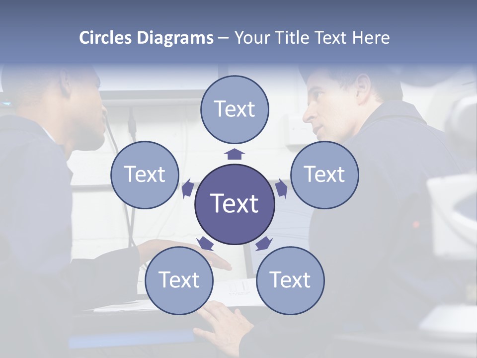 A Couple Of Men Sitting In Front Of A Laptop Computer PowerPoint Template