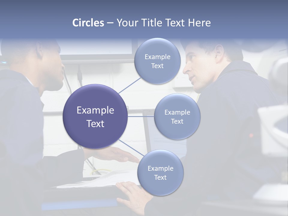 A Couple Of Men Sitting In Front Of A Laptop Computer PowerPoint Template