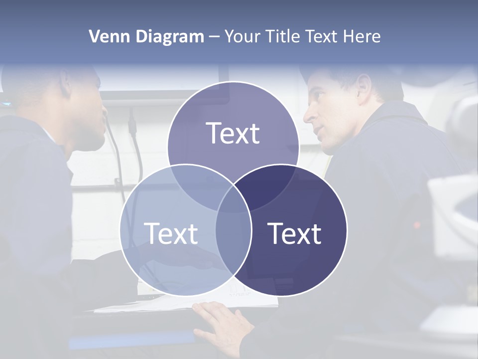 A Couple Of Men Sitting In Front Of A Laptop Computer PowerPoint Template