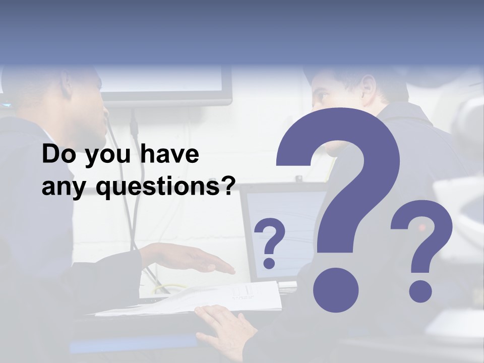 A Couple Of Men Sitting In Front Of A Laptop Computer PowerPoint Template