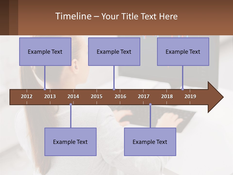 A Woman Sitting At A Desk With A Computer PowerPoint Template