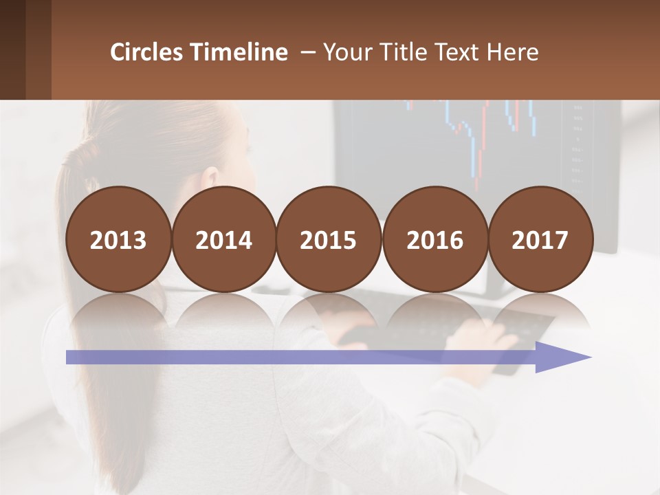 A Woman Sitting At A Desk With A Computer PowerPoint Template