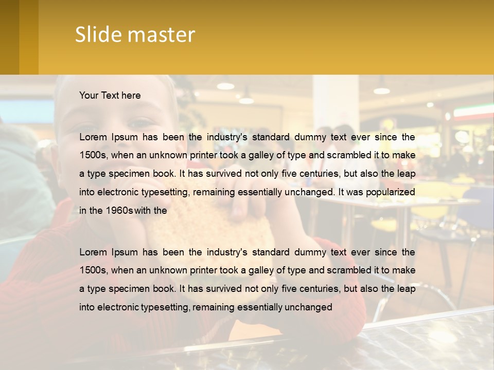 A Young Boy Eating A Sandwich In A Restaurant PowerPoint Template