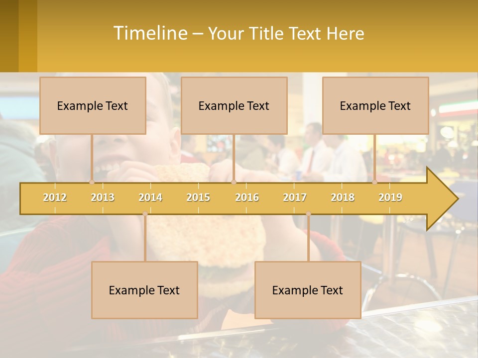 A Young Boy Eating A Sandwich In A Restaurant PowerPoint Template