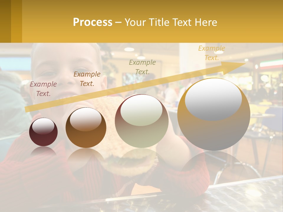 A Young Boy Eating A Sandwich In A Restaurant PowerPoint Template