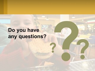 A Young Boy Eating A Sandwich In A Restaurant PowerPoint Template