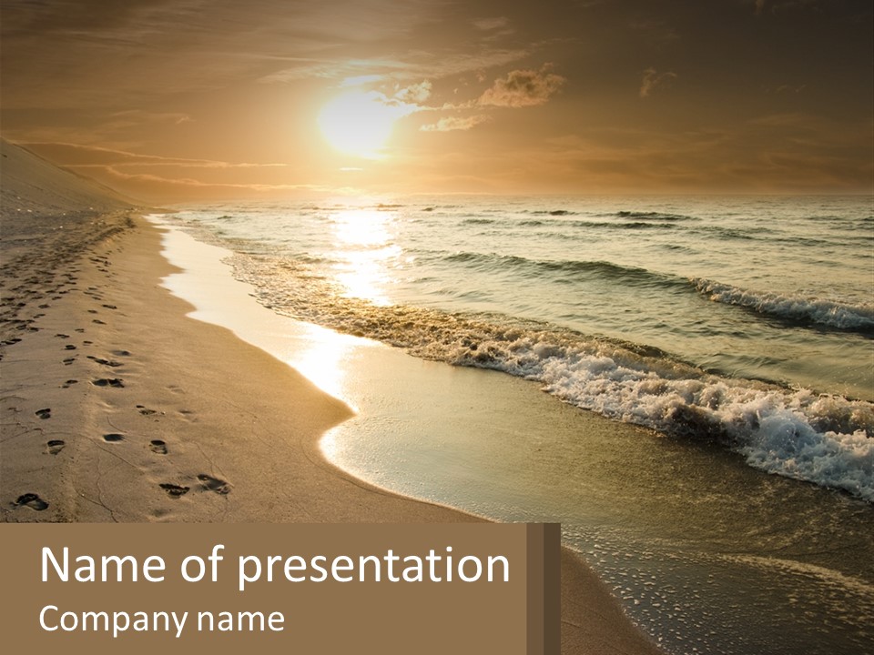 A Sandy Beach With Footprints In The Sand PowerPoint Template